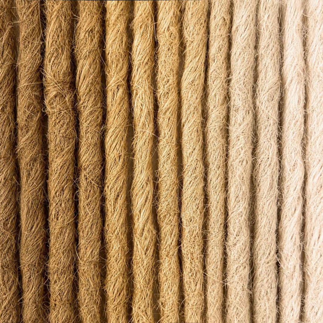 Handcrafted human hair Loc Extensions in the Blonde Color Family featuring warm blonde, beige, and light natural shades. 