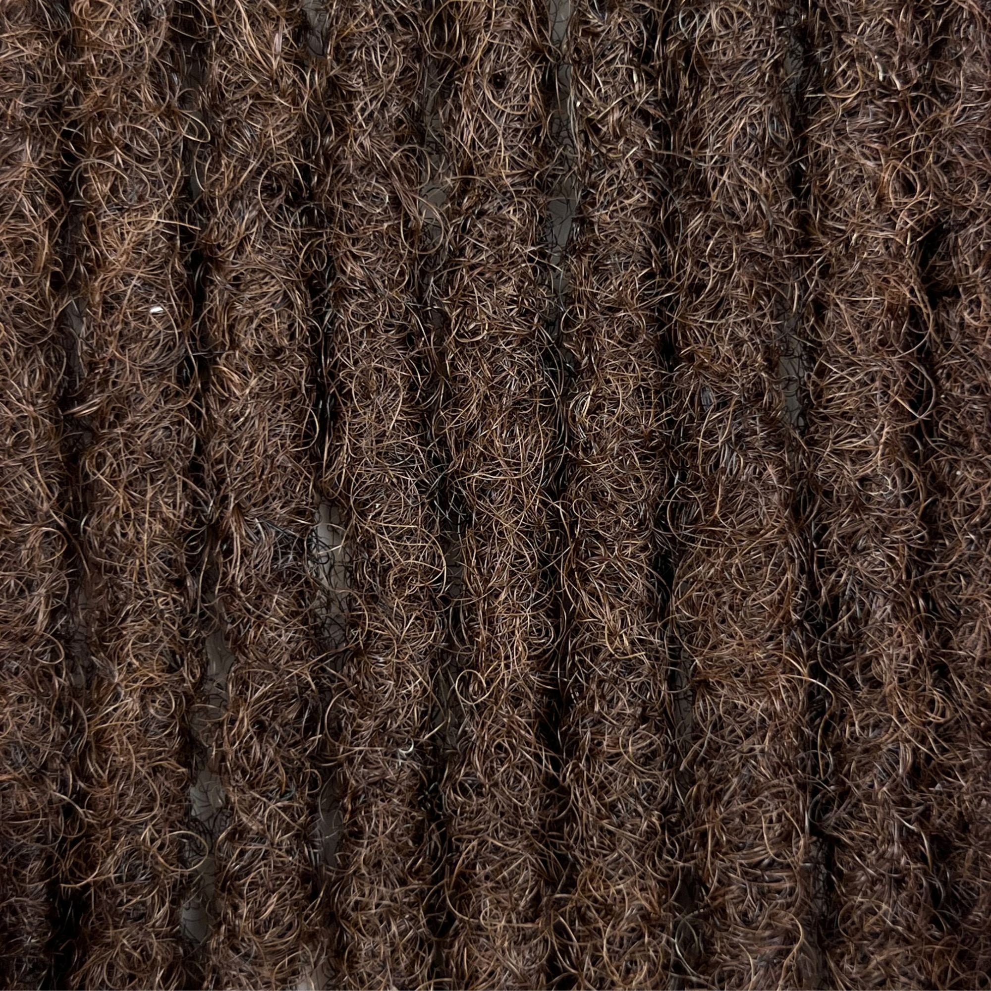 Close-up of Medium Brown kinky human hair loc extensions made using the crochet method.