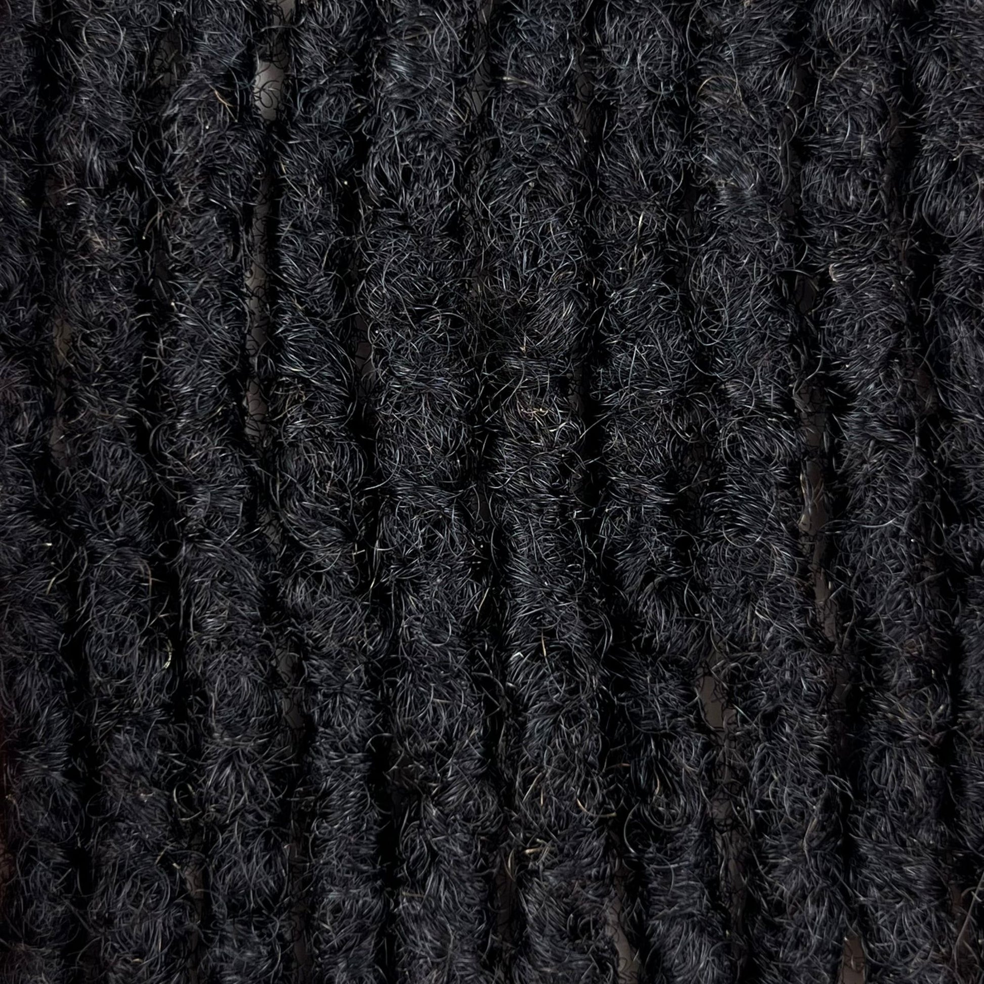 Close-up of Dark Brown kinky human hair loc extensions made using the interlocking method.