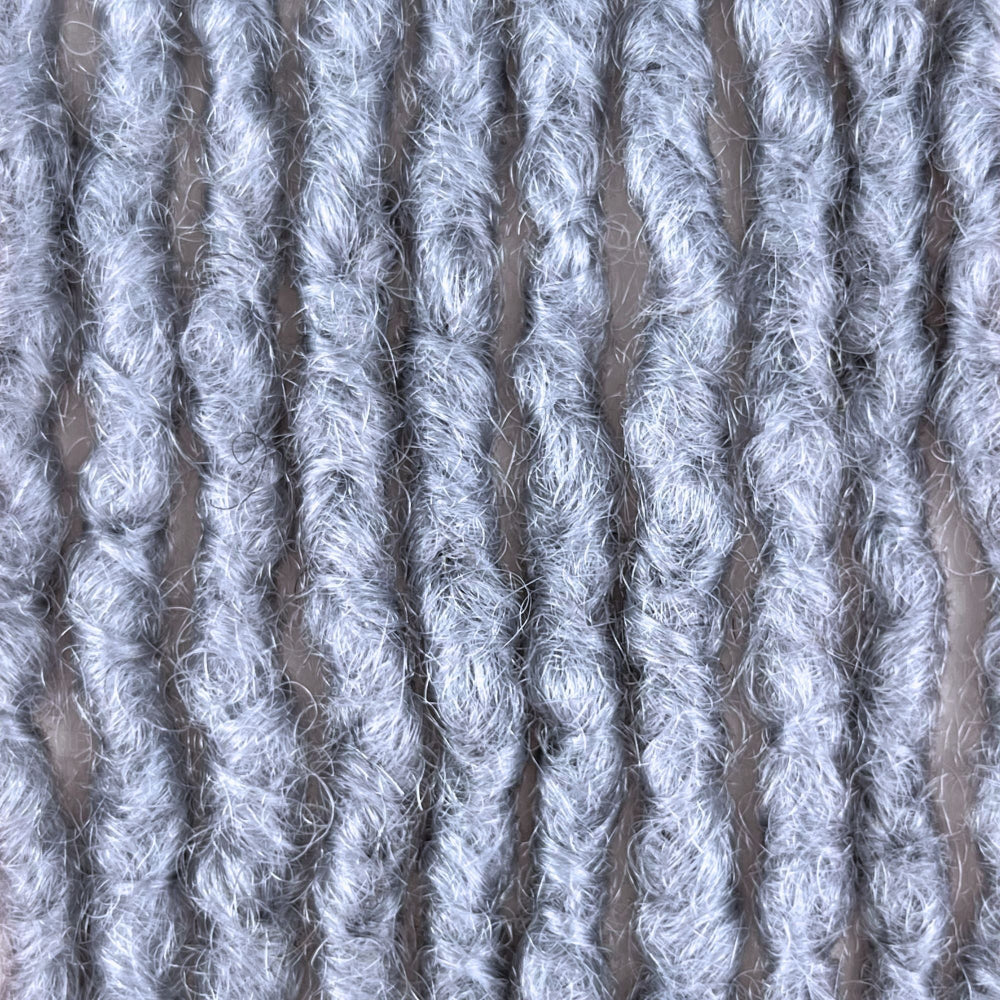 Close-up of Grey kinky human hair loc extensions made using the interlocking method.