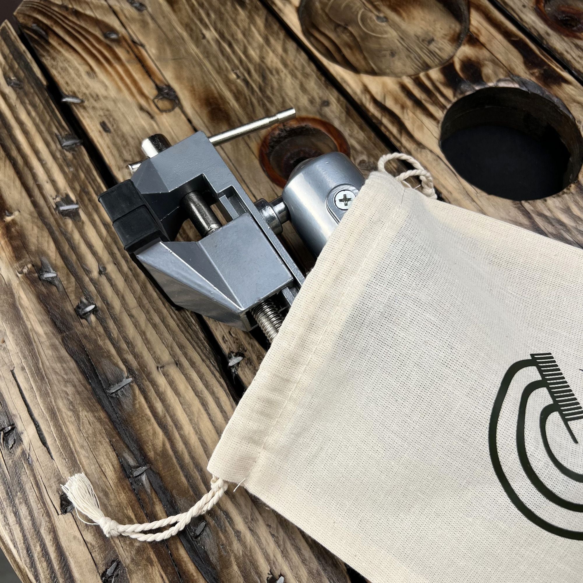 Loc Vise for creating and repairing handcrafted Locs shown in a partial product view with storage pouch.