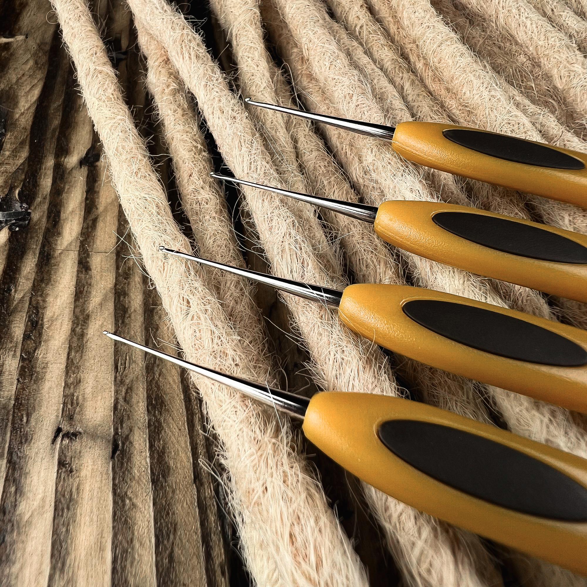 Close-up of the fine hook tips of Clover Micro Crochet Hooks for precise Loc and Dreadlock maintenance.