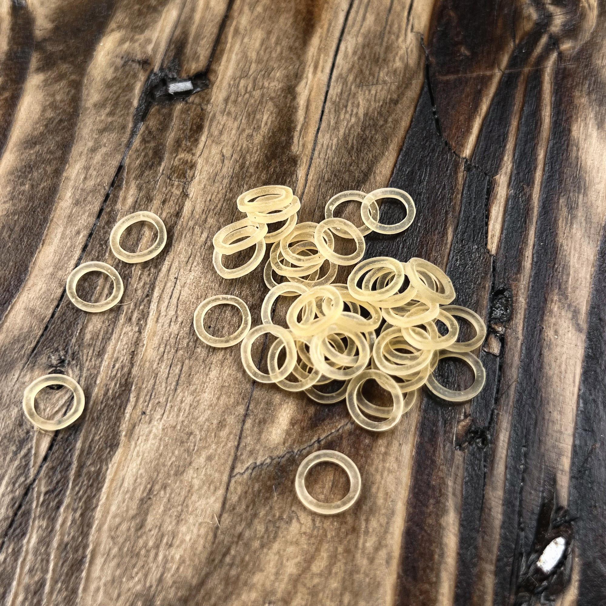 Close-up of natural rubber bands used for creating Loc Extensions and securing temporary Human Hair and Synthetic Locs.