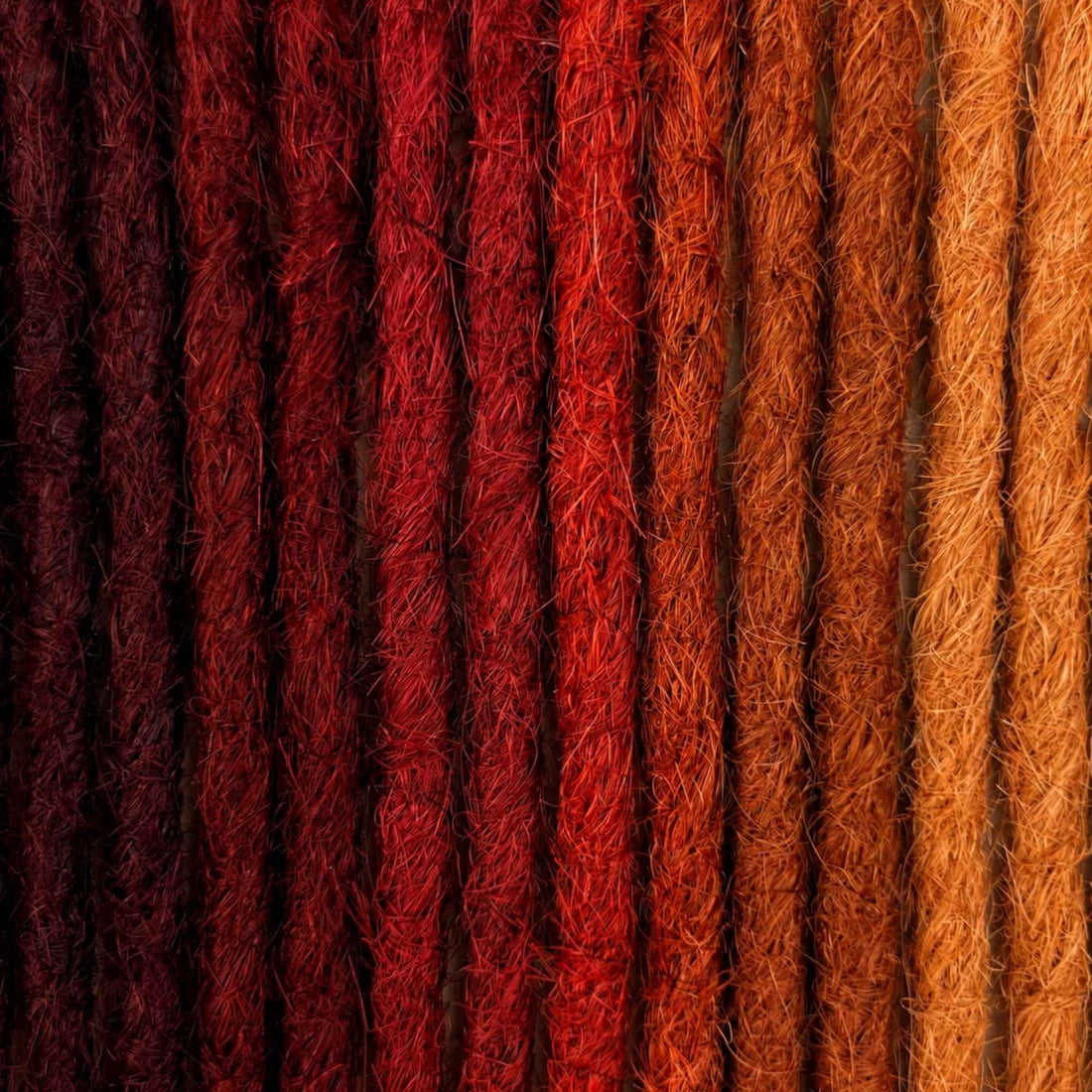 Handcrafted human hair Loc Extensions in the Red Color Family featuring auburn, copper, ginger, and rich red shades.