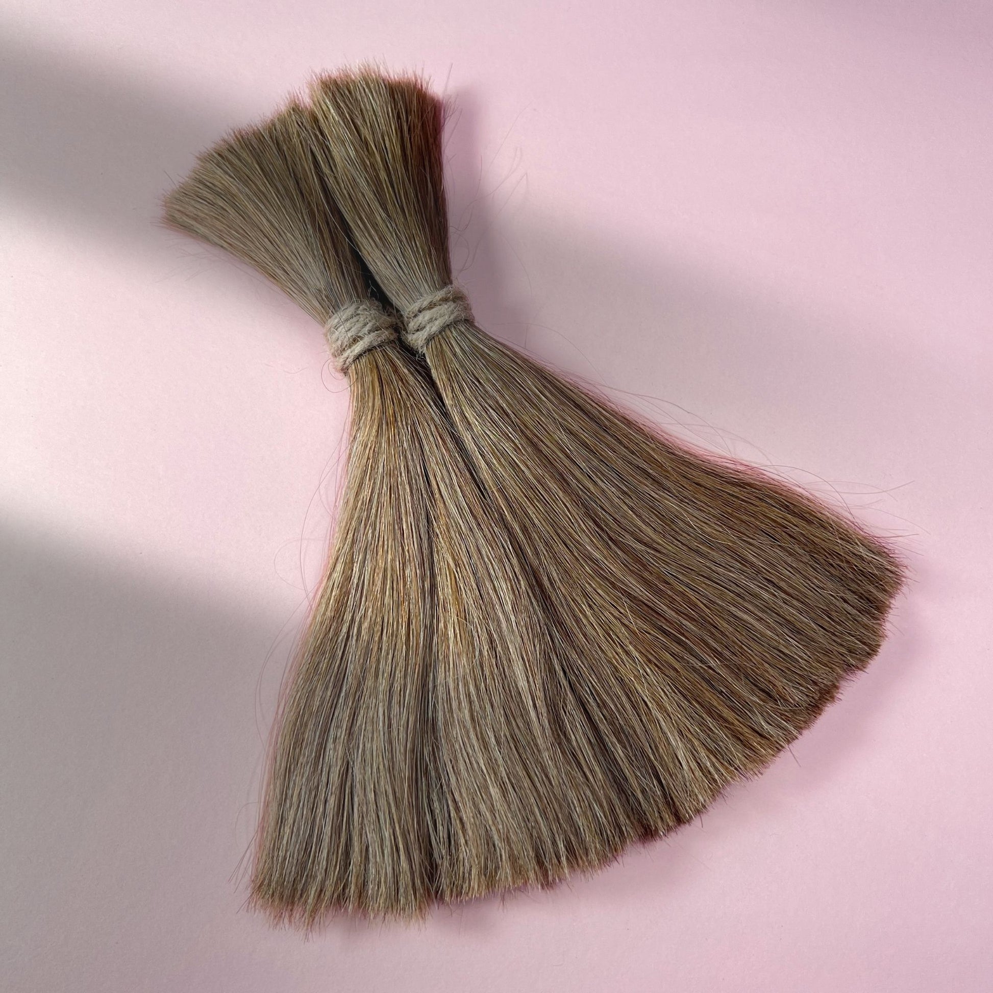 Full view of straight human hair in Light Beige Blonde.