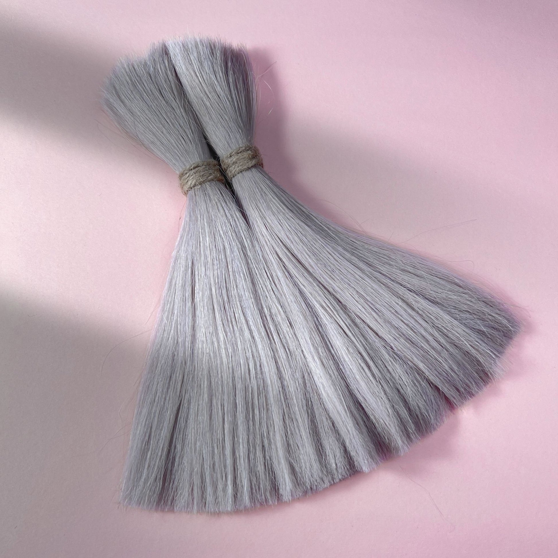 Full view of straight human hair in Pearl Silver.