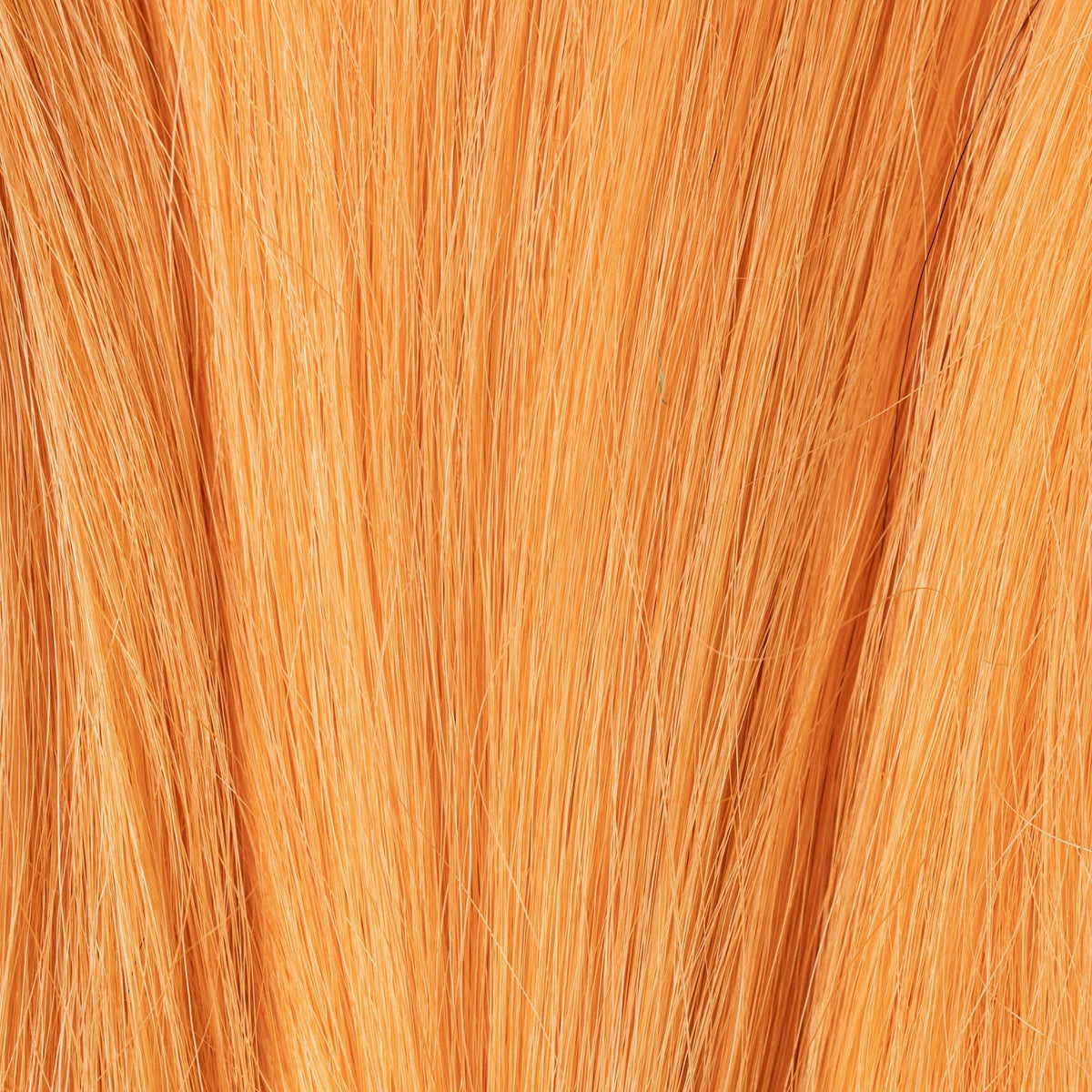 Close-up of Peach Fuzz loose human hair texture for Straight Loc Extensions
