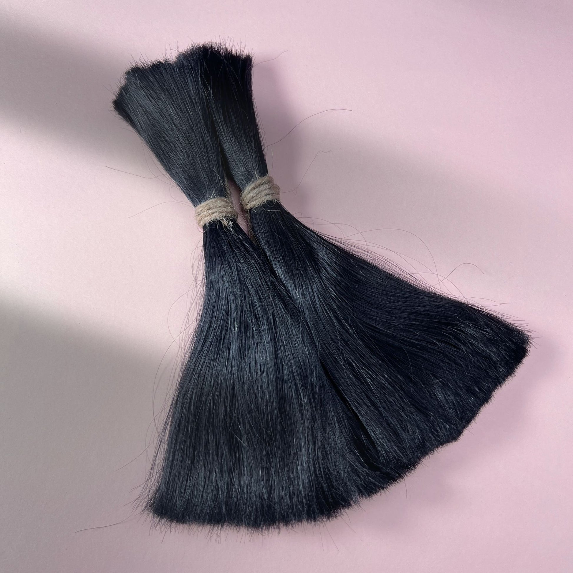 Full view of straight human hair in Deepest Black.